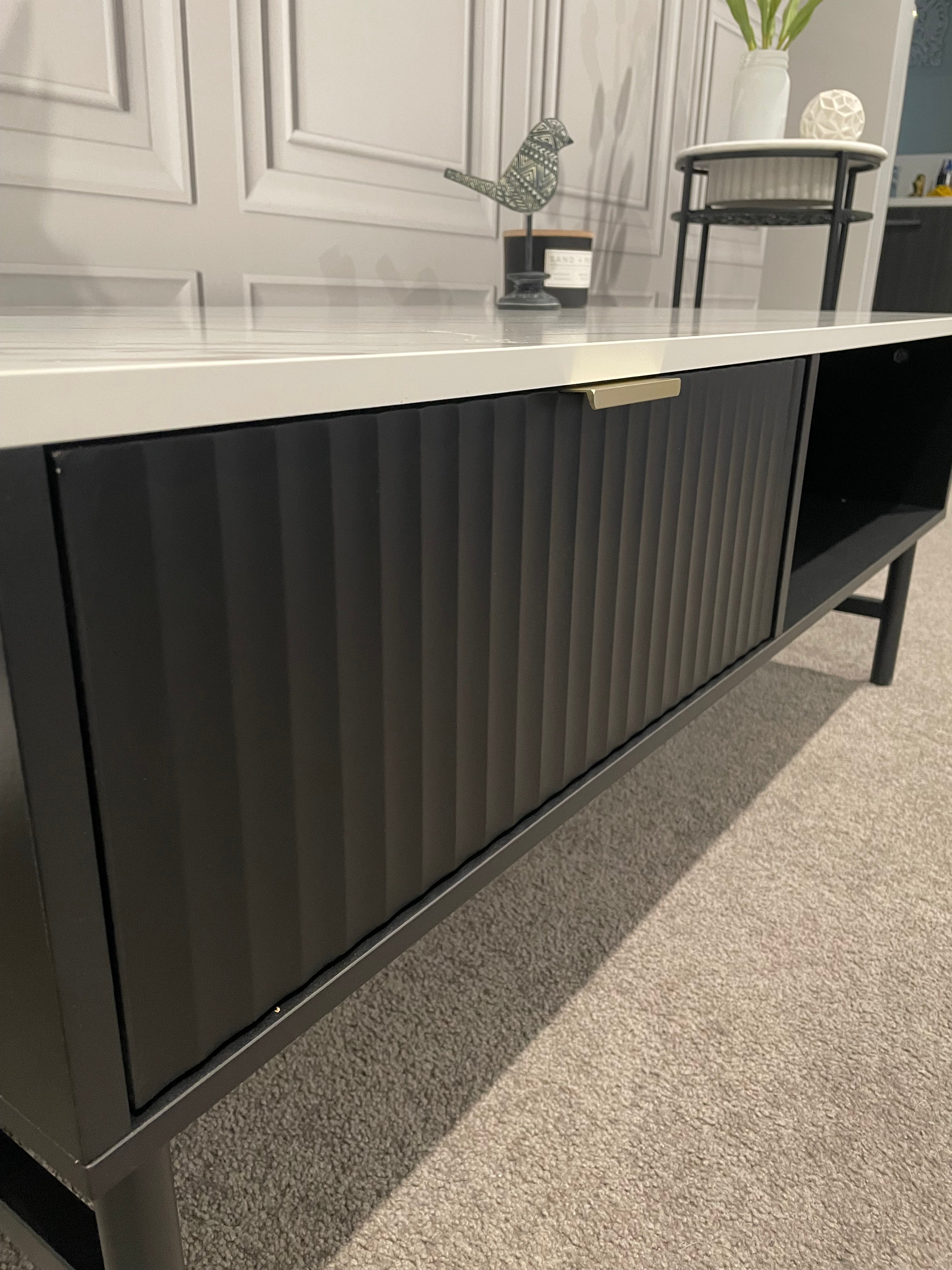 Modern Black Coffee Table with Fluted Front & Marble-Look Top – 110cm