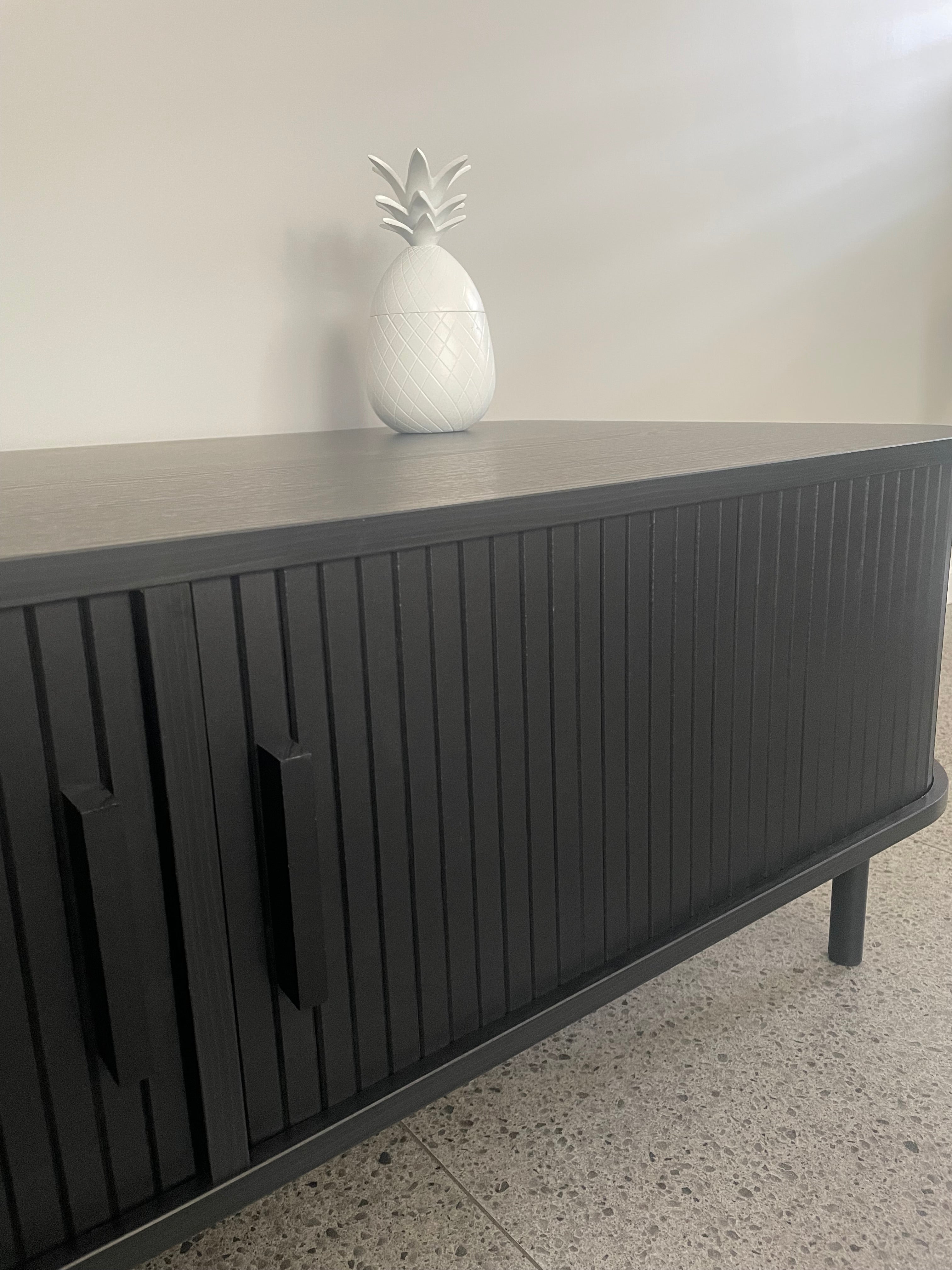 Modern Black Coffee Table with Sliding Fluted Doors – 120cm