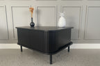 Modern Black Coffee Table with Sliding Fluted Doors – 120cm